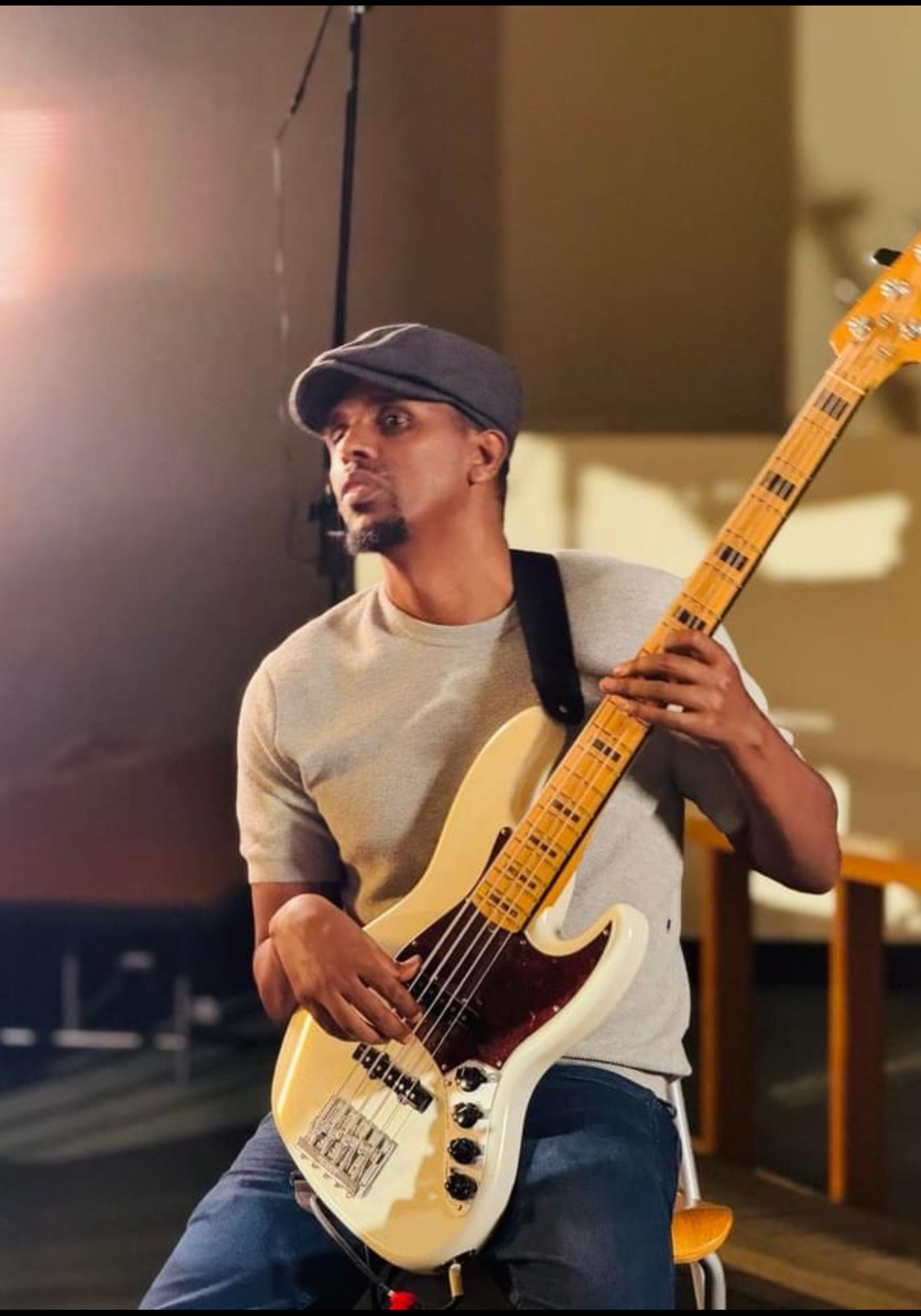 Aman playing bass guitar